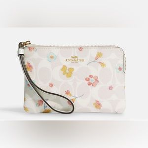 White coach floral wristlet